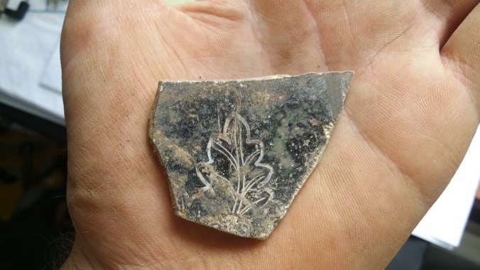 A fragment of medieval glass found during the dig